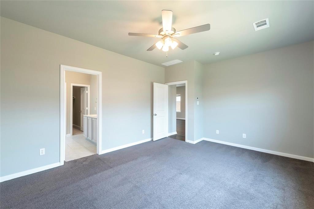 2069 Hartley Drive Forney, TX 75126 - Photo 10 of 27 an empty room with closet and fan
