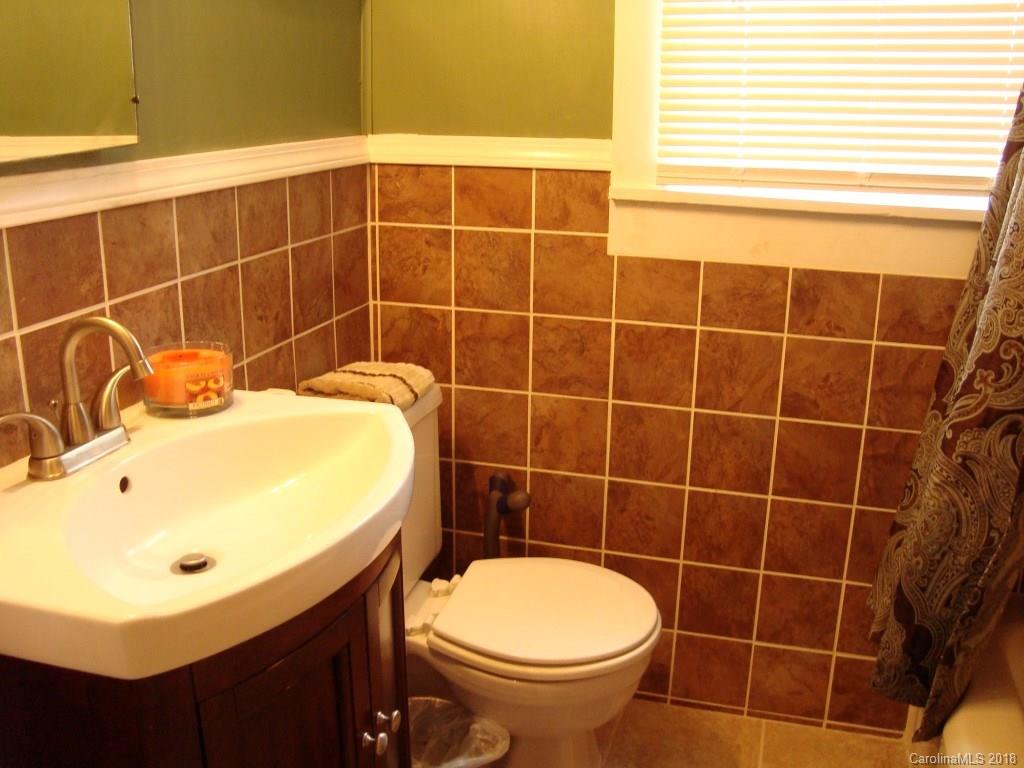 85 Wall Road Tryon, NC 28782 - Photo 14 of 22 a bathroom with a sink toilet and shower