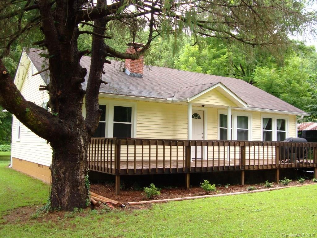 85 Wall Road Tryon, NC 28782 - Photo 19 of 22 a front view of a house with garden