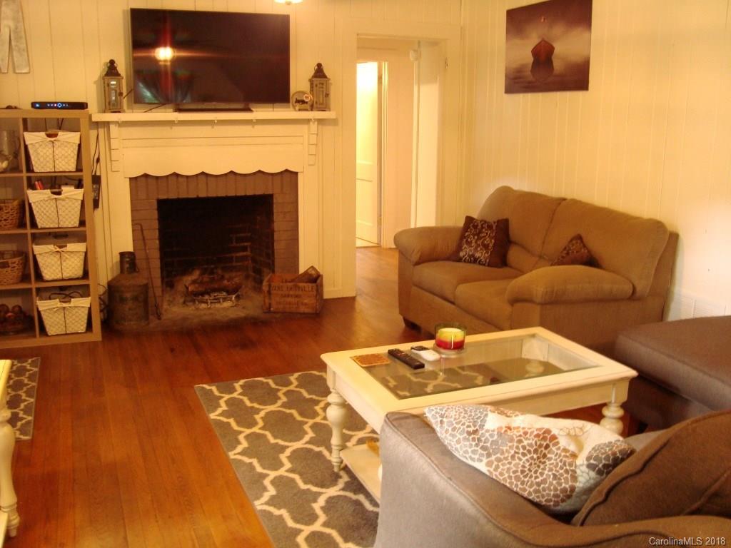 85 Wall Road Tryon, NC 28782 - Photo 5 of 22 a living room with furniture and a fireplace