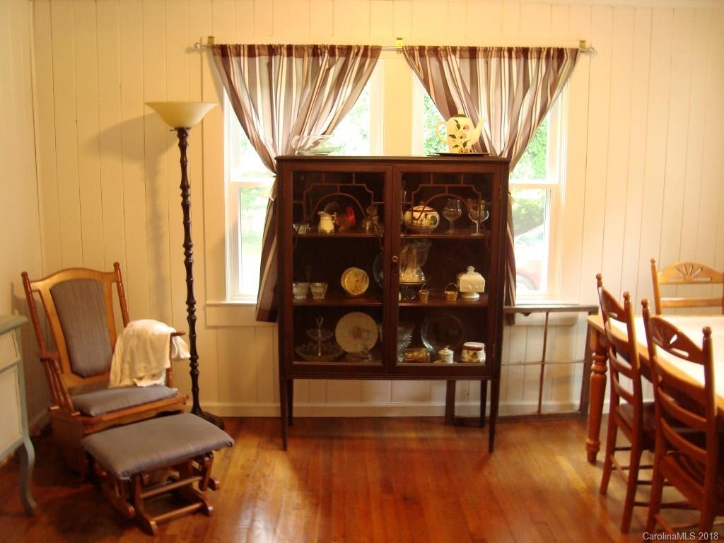 85 Wall Road Tryon, NC 28782 - Photo 8 of 22 a view of a chairs in a room with wooden floor