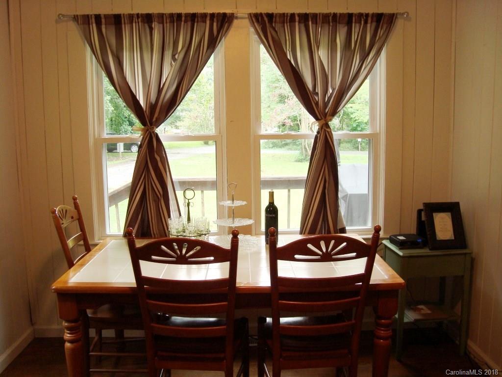 85 Wall Road Tryon, NC 28782 - Photo 9 of 22 a view of a dining room with furniture and window
