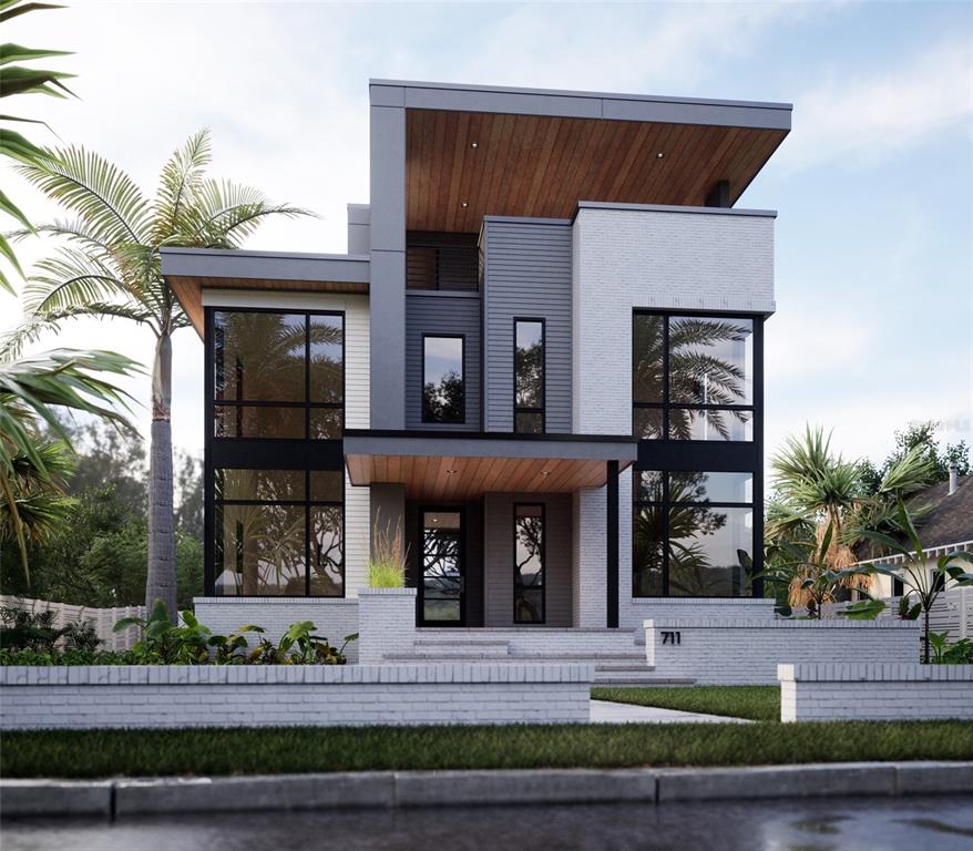 711 West Ross Avenue Tampa, FL 33602 - Photo 1 of 31 a front view of a house with garden and plants