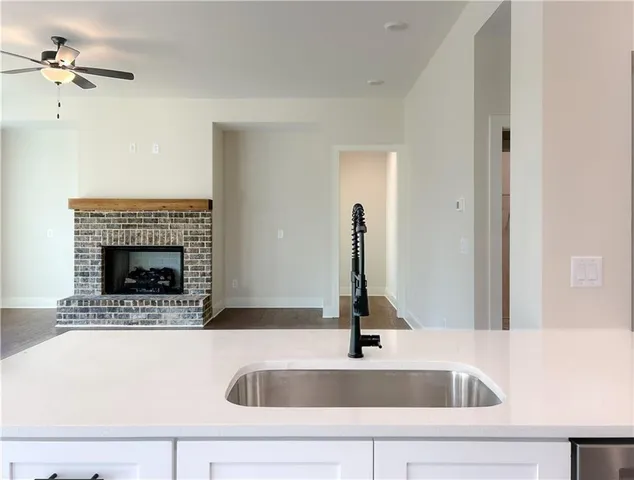 a kitchen with a sink and a stove