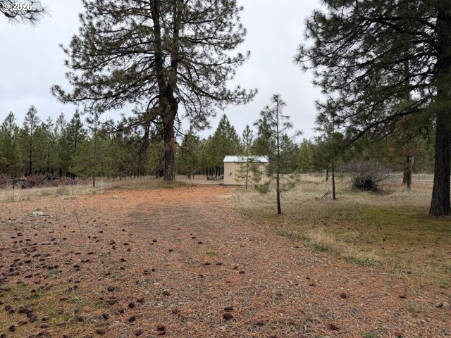 Garrison Road, Unit 1 Goldendale, WA 98620 - Photo 4 of 14 a view of outdoor space with deck and tree