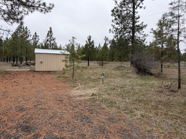 Garrison Road, Unit 1 Goldendale, WA 98620 - Photo 8 of 14 a view of a dry yard with wooden fence