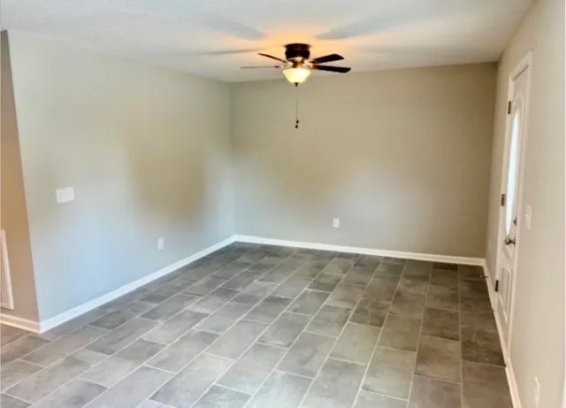 a kitchen with stainless steel appliances a stove microwave and sink
