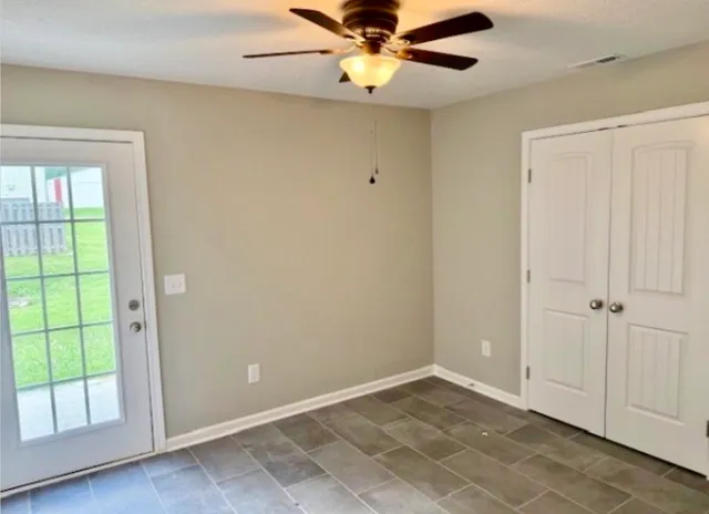an empty room with closet area