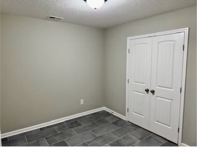 a bathroom with a toilet a sink and bathtub