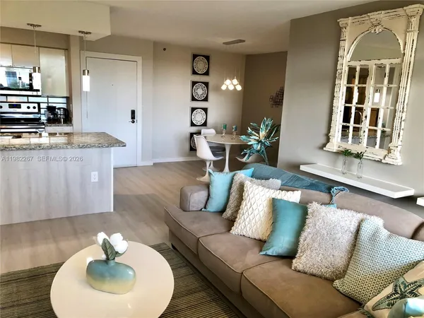a living room with furniture and a large window