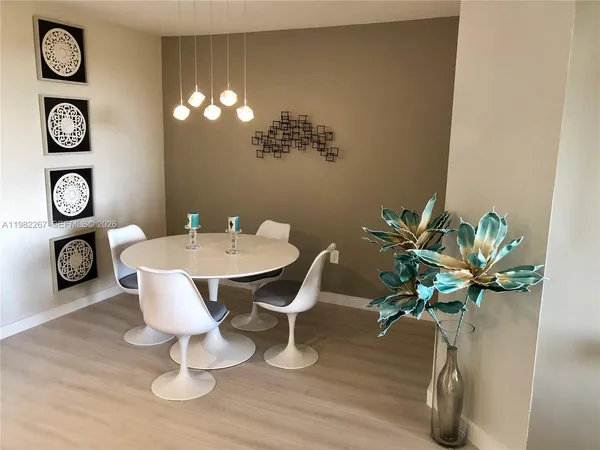 a living room with a sink and a table