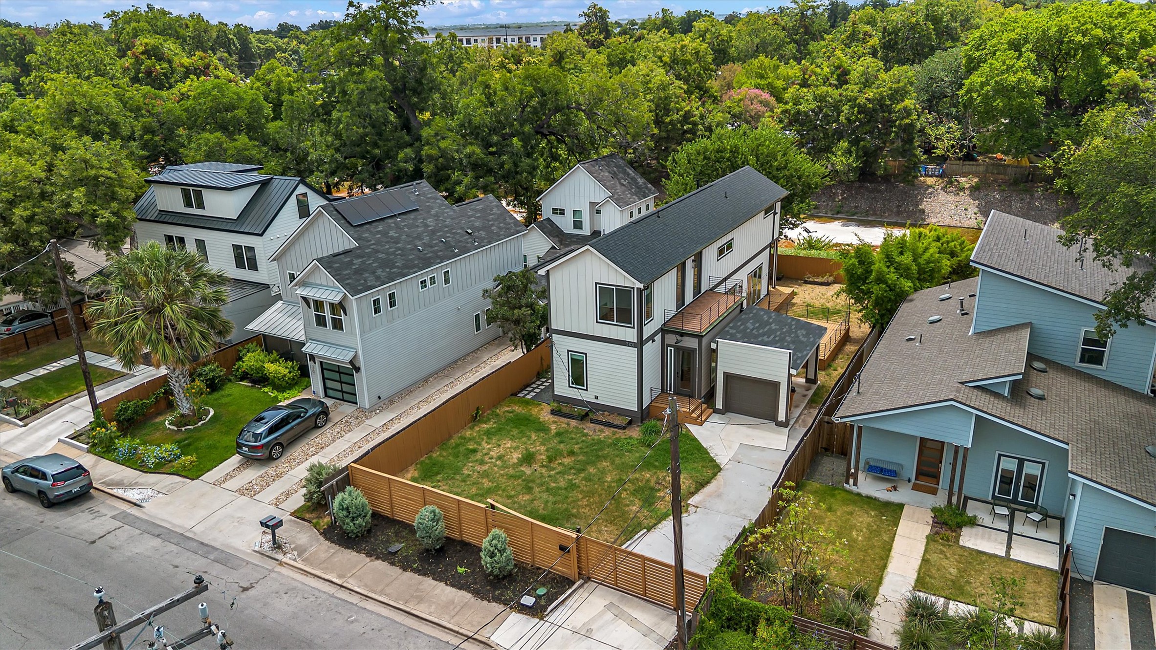 3101 Lyons Road Austin, TX 78702 - Photo 36 of 40 Aerial view showcasing modern homes amidst verdant landscaping.