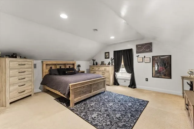 a bedroom with a bed and dresser