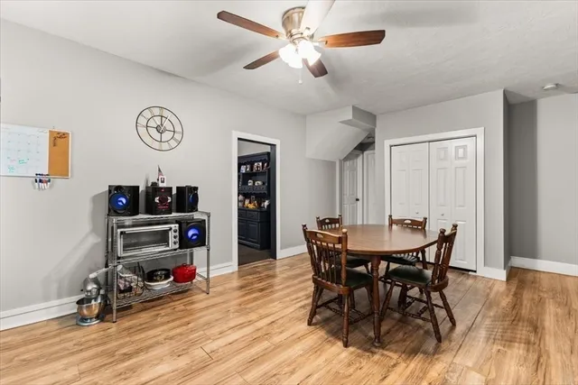 a view of a dining room with furniture and wooden floor