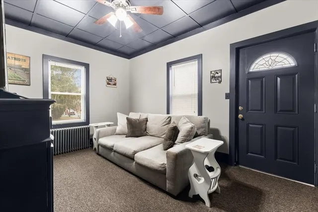 a living room with furniture and a window