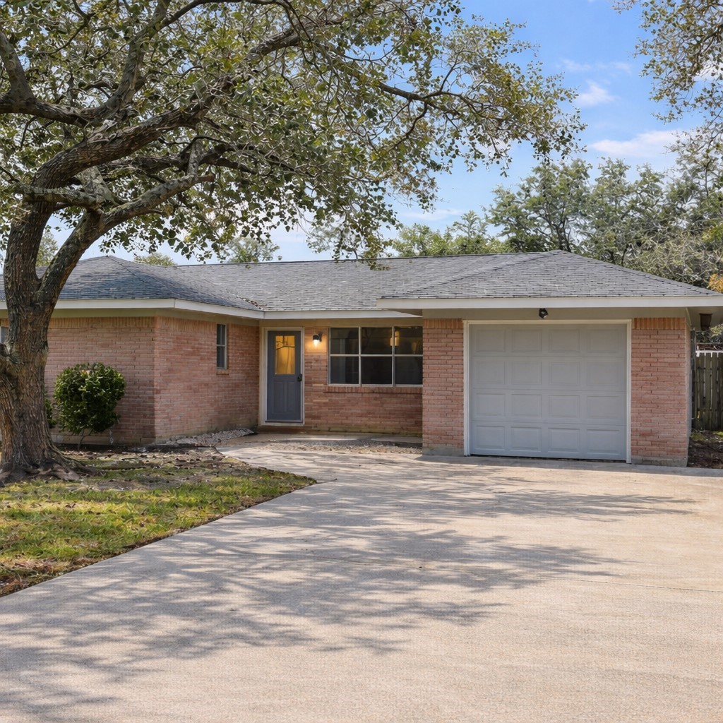 Lots of updates including kitchen and bathrooms, beautiful shade tree and native Texas landscaping, and fully fenced backyard