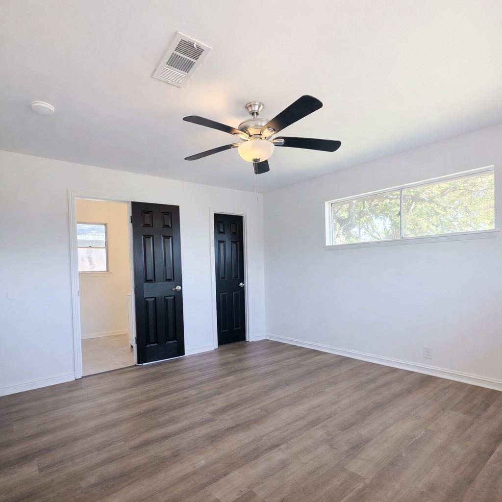 1820 Sunset Avenue Bay City, TX 77414 - Photo 11 of 26 Primary bedroom with ensuite bath and walk-in closet.