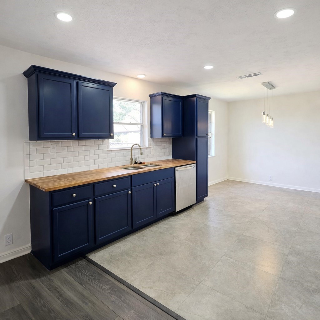 1820 Sunset Avenue Bay City, TX 77414 - Photo 3 of 26 Kitchen is light and bright with recessed lighting, tile floors, breakfast nook, recently updated cabinets and appliances.