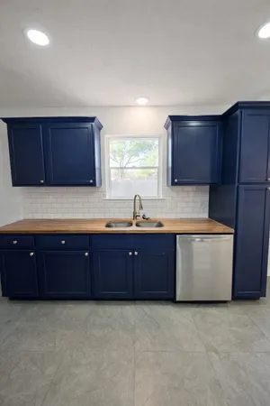 a kitchen with wooden cabinets