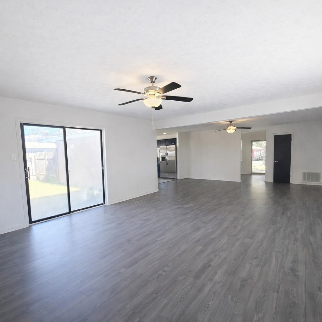 1820 Sunset Avenue Bay City, TX 77414 - Photo 9 of 26 Imagine enjoying this large living space. Furniture placement would be easy! Sliding door opens to concrete patio and fully fenced backyard.