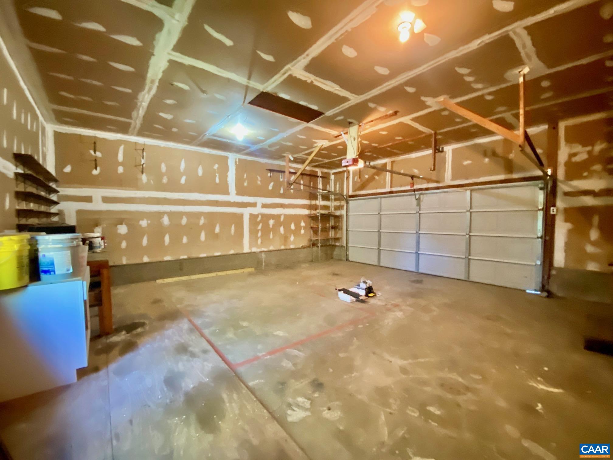 247 Goldenrod Road Ruckersville, VA 22968 - Photo 27 of 35 a view of a garage with wooden shelves