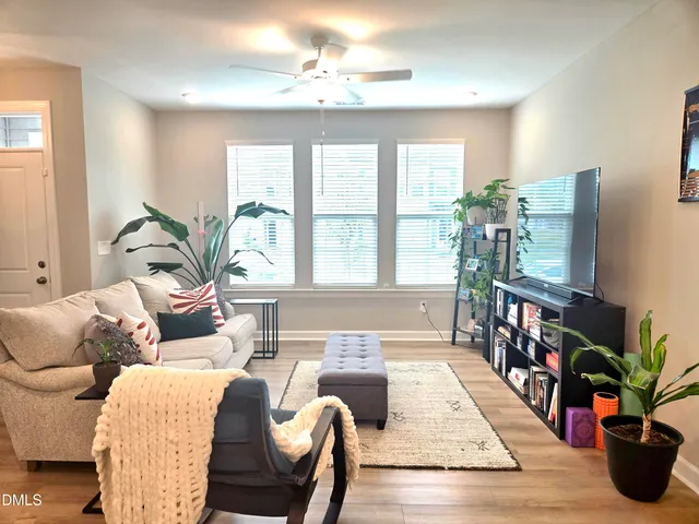 a living room with furniture fireplace and flat screen tv