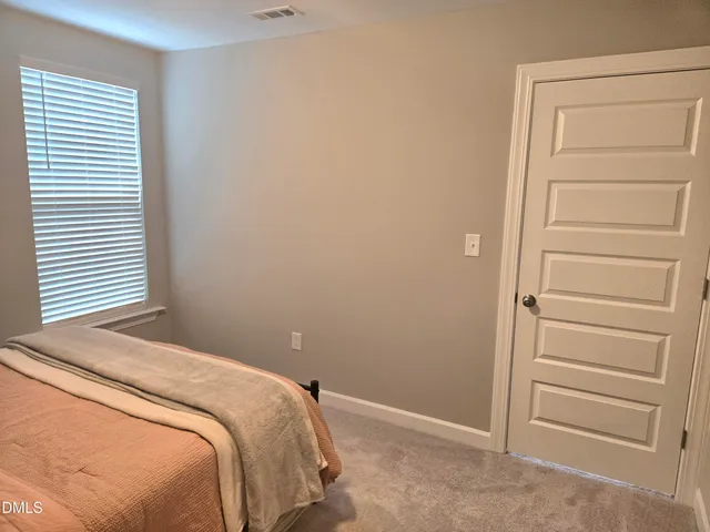 a room with a cabinets and a window