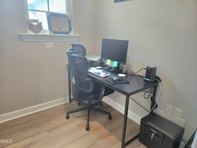 a view of a workspace with furniture