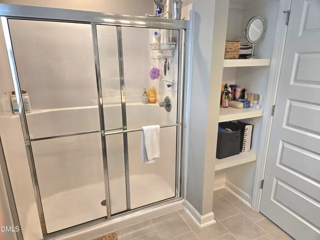 a bathroom with a sink toilet and window