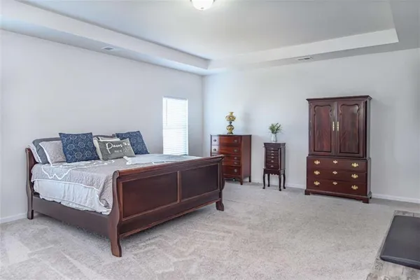 a bedroom with a bed and a cabinets