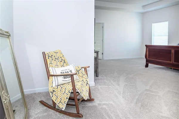 an entryway with a table and mirror