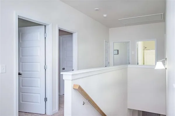 a view of an entryway with wooden floor