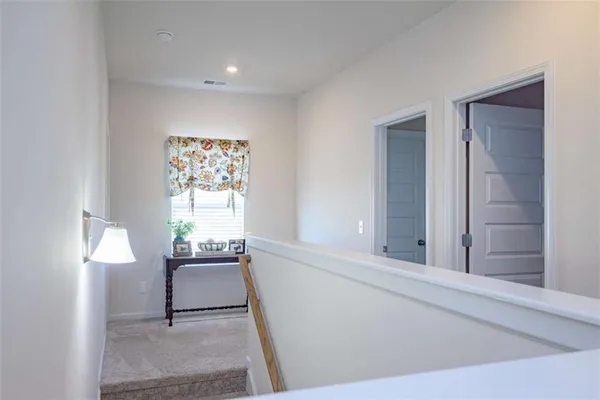 a view of a room with a window and chair