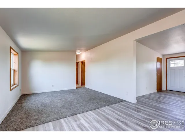 a view of an empty room and window
