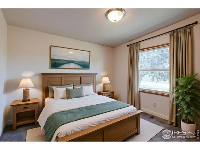 a bedroom with a bed and a potted plant