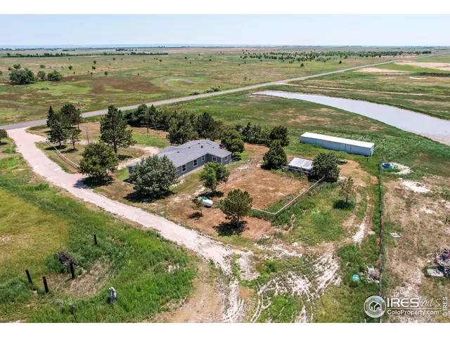 a view of a lake with a yard
