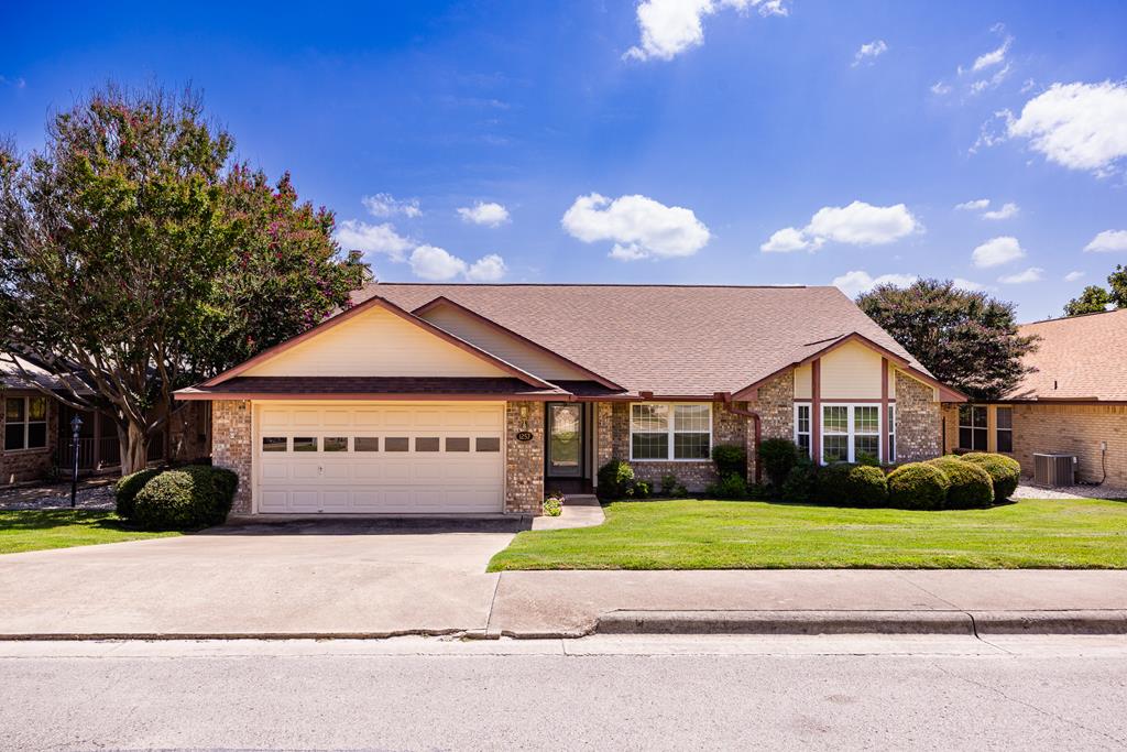 a view of house with a garden