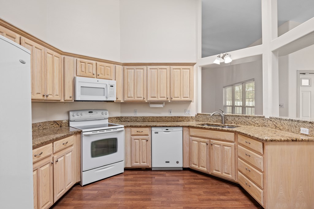 1257 Victory Kerrville, TX 78028 - Photo 11 of 31 a kitchen with stainless steel appliances granite countertop a stove sink and cabinets