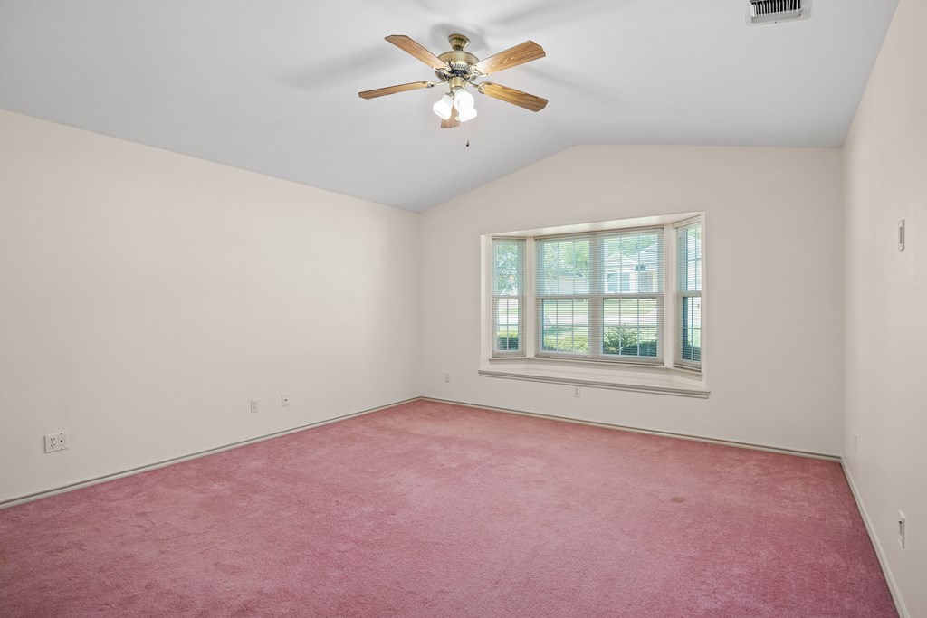1257 Victory Kerrville, TX 78028 - Photo 15 of 31 an empty room with a window and a fan