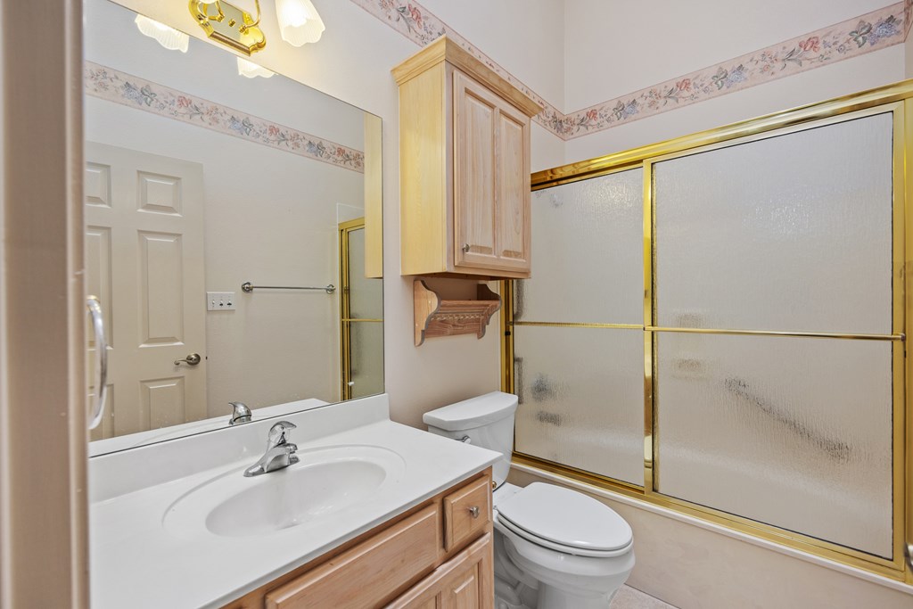 1257 Victory Kerrville, TX 78028 - Photo 16 of 31 a bathroom with a sink toilet and shower