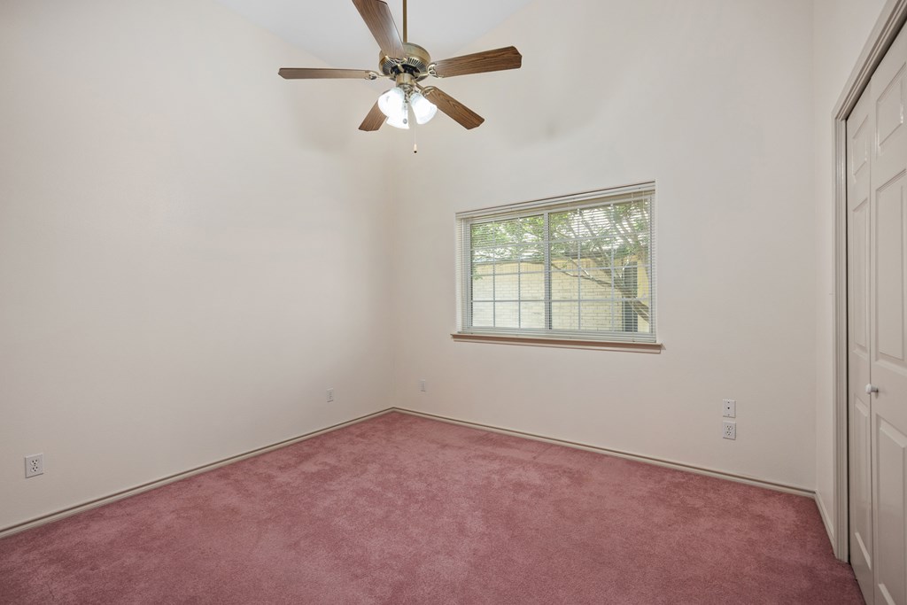 1257 Victory Kerrville, TX 78028 - Photo 17 of 31 an empty room with a window and a fan
