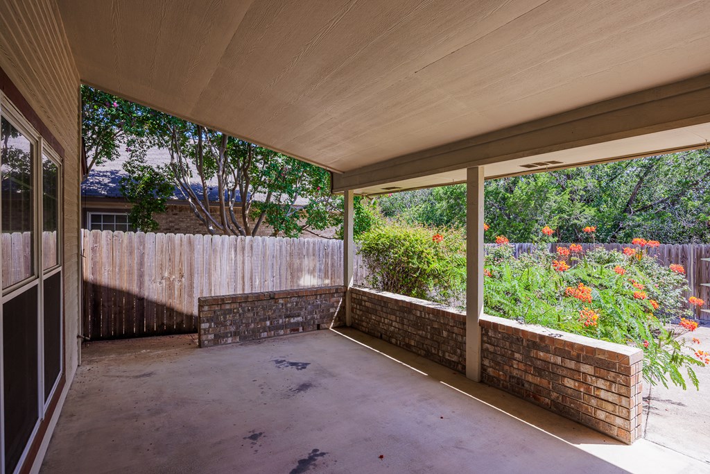 1257 Victory Kerrville, TX 78028 - Photo 19 of 31 a view of a backyard with a large trees and wooden fence