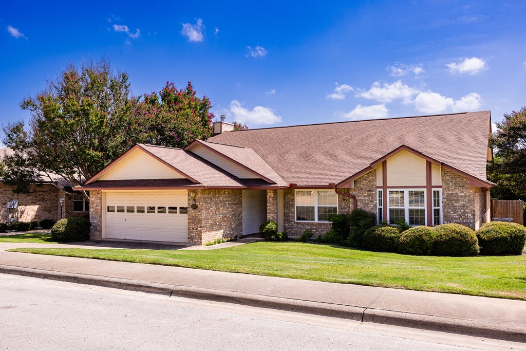 1257 Victory Kerrville, TX 78028 - Photo 29 of 31 a front view of a house with a yard and garage