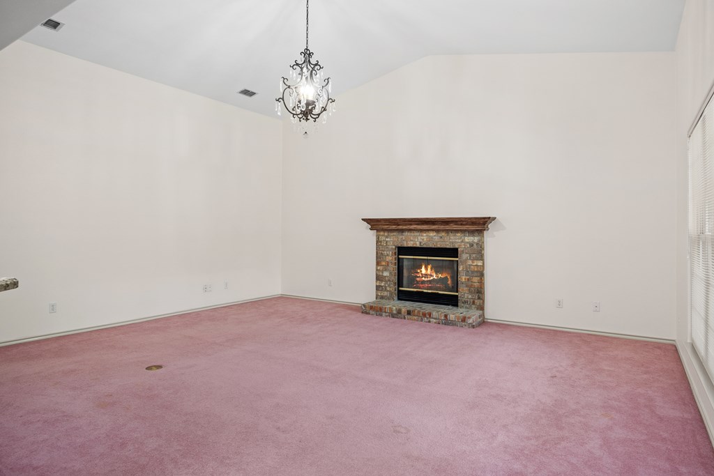 1257 Victory Kerrville, TX 78028 - Photo 9 of 31 a view of an empty room with a fireplace