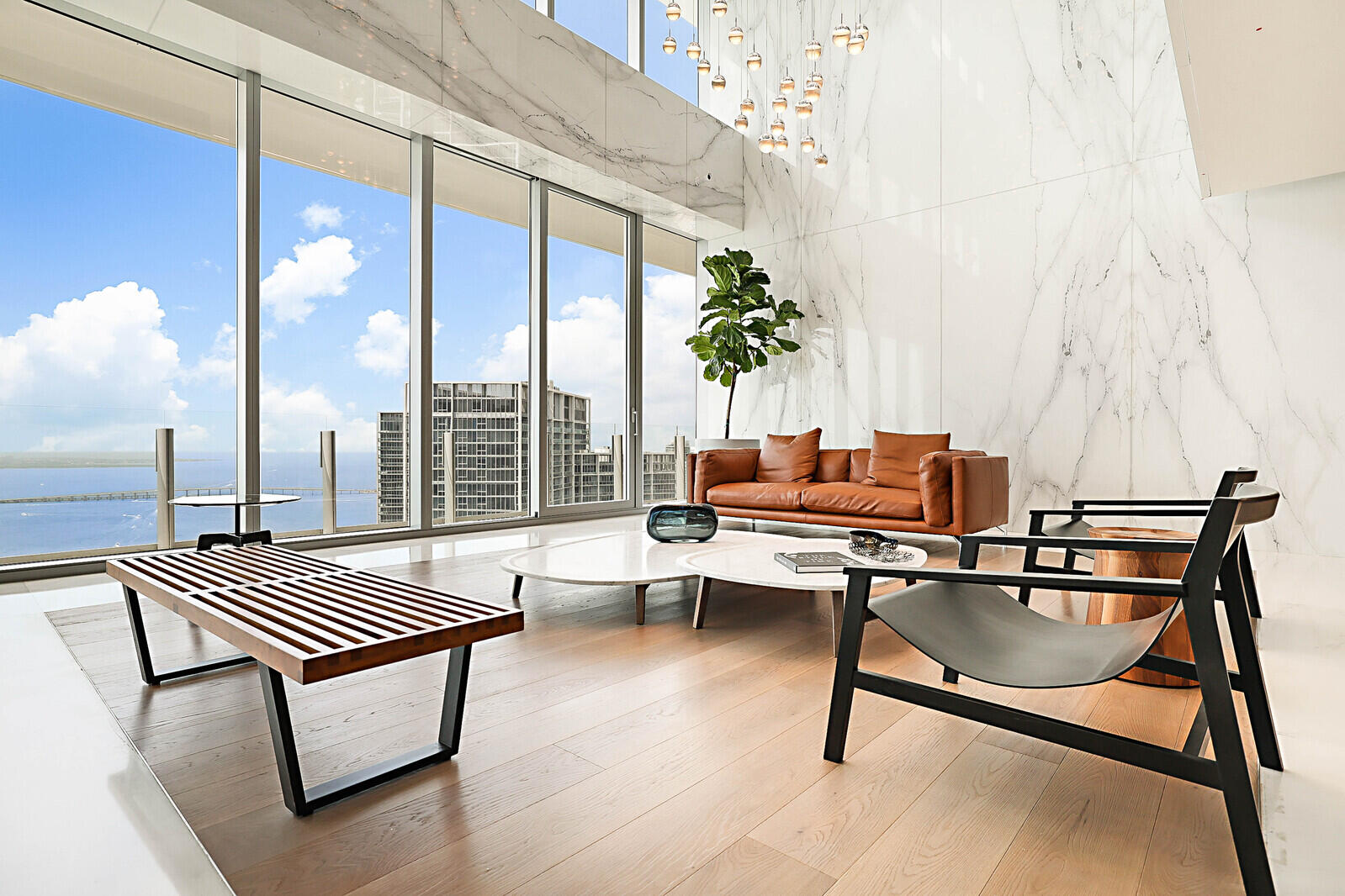 300 Biscayne Blvd Way, Unit 1907 Miami, FL 33131 - Photo 30 of 43 a living room with patio furniture and a potted plant