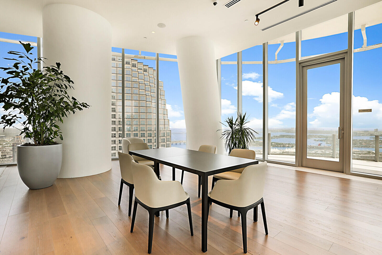300 Biscayne Blvd Way, Unit 1907 Miami, FL 33131 - Photo 36 of 43 a dining room with furniture and wooden floor