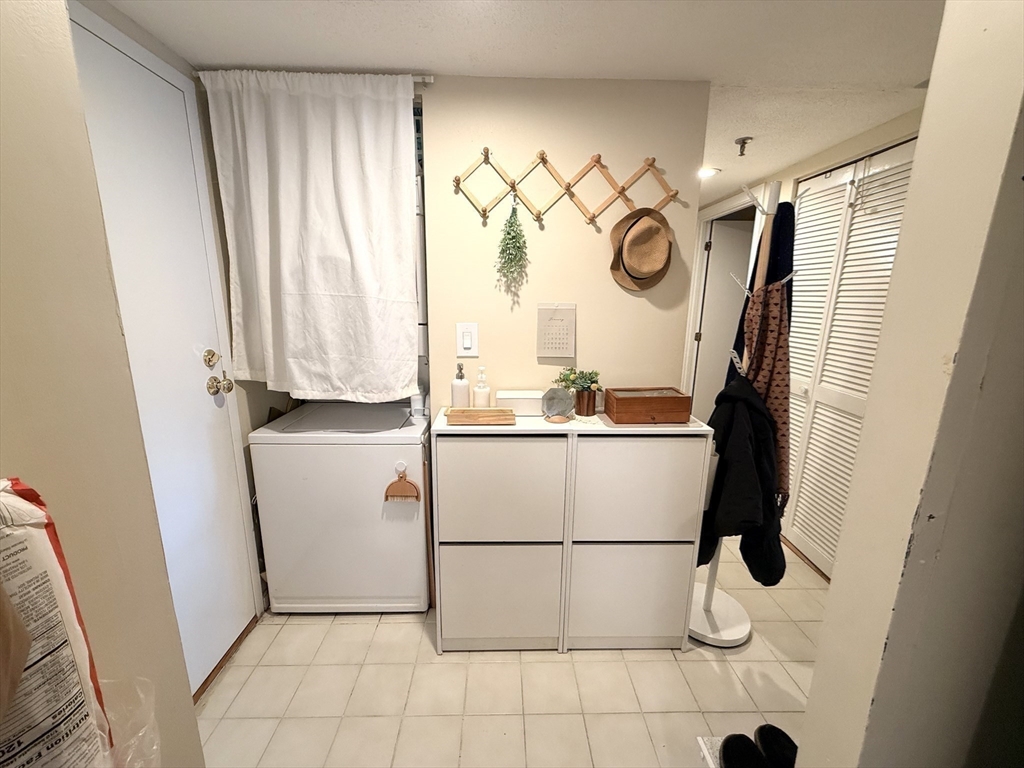 20 Webster Street, Unit 307 Brookline, MA 02446 - Photo 12 of 31 a white refrigerator freezer sitting inside of a kitchen