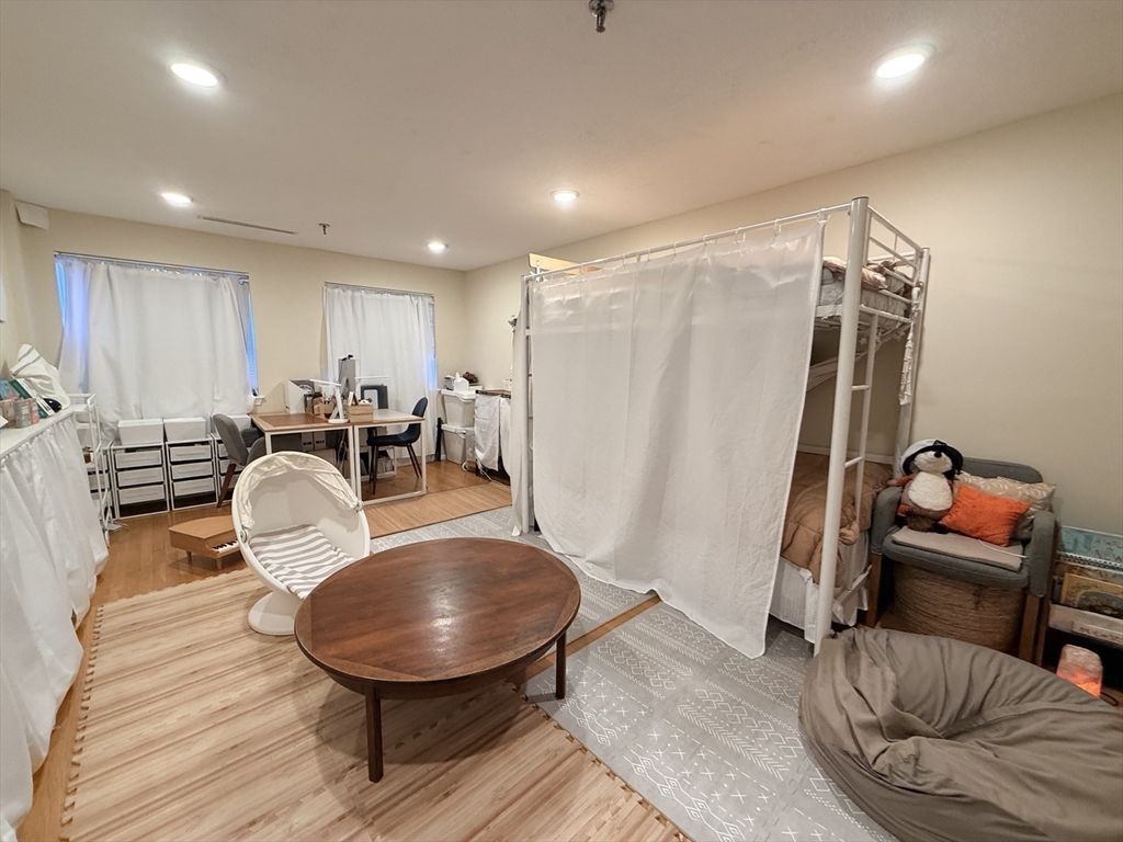 20 Webster Street, Unit 307 Brookline, MA 02446 - Photo 14 of 31 a room with furniture and wooden floor