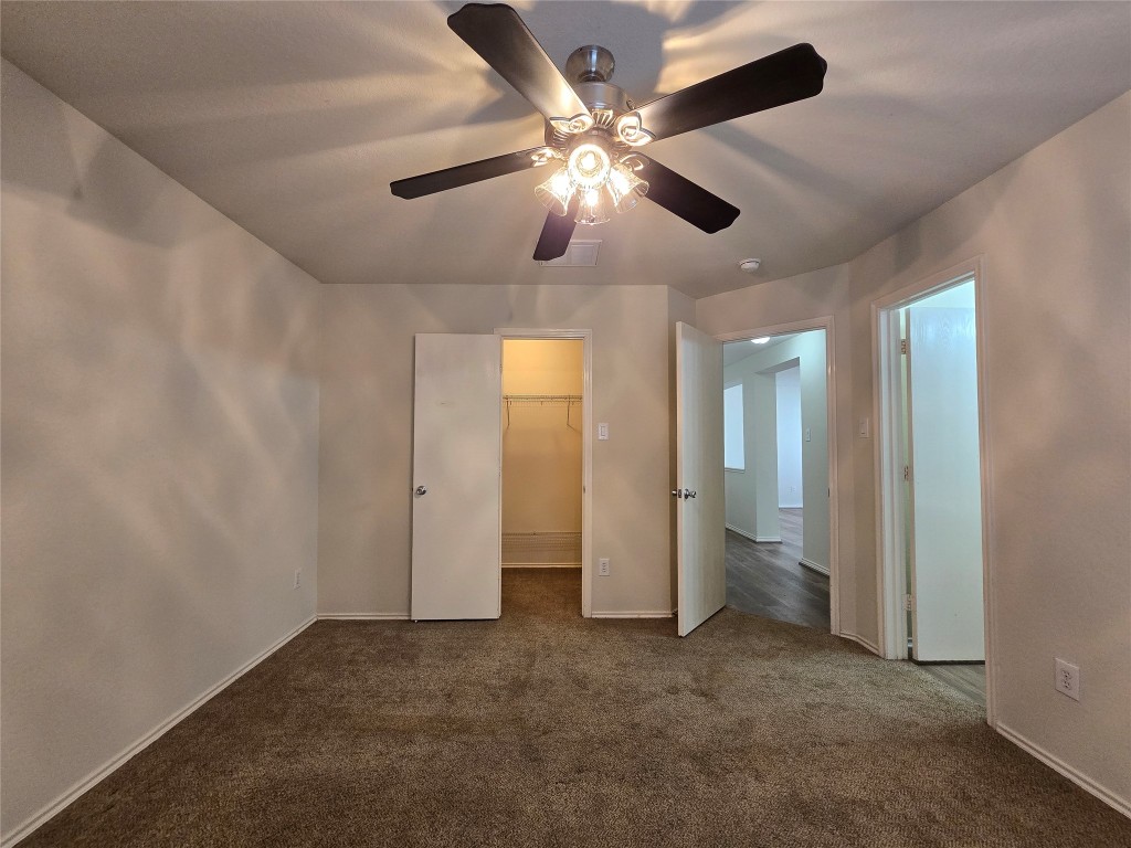 6527 Fairbrook Park Lane Spring, TX 77379 - Photo 12 of 17 wooden floor in an empty room and a ceiling fan