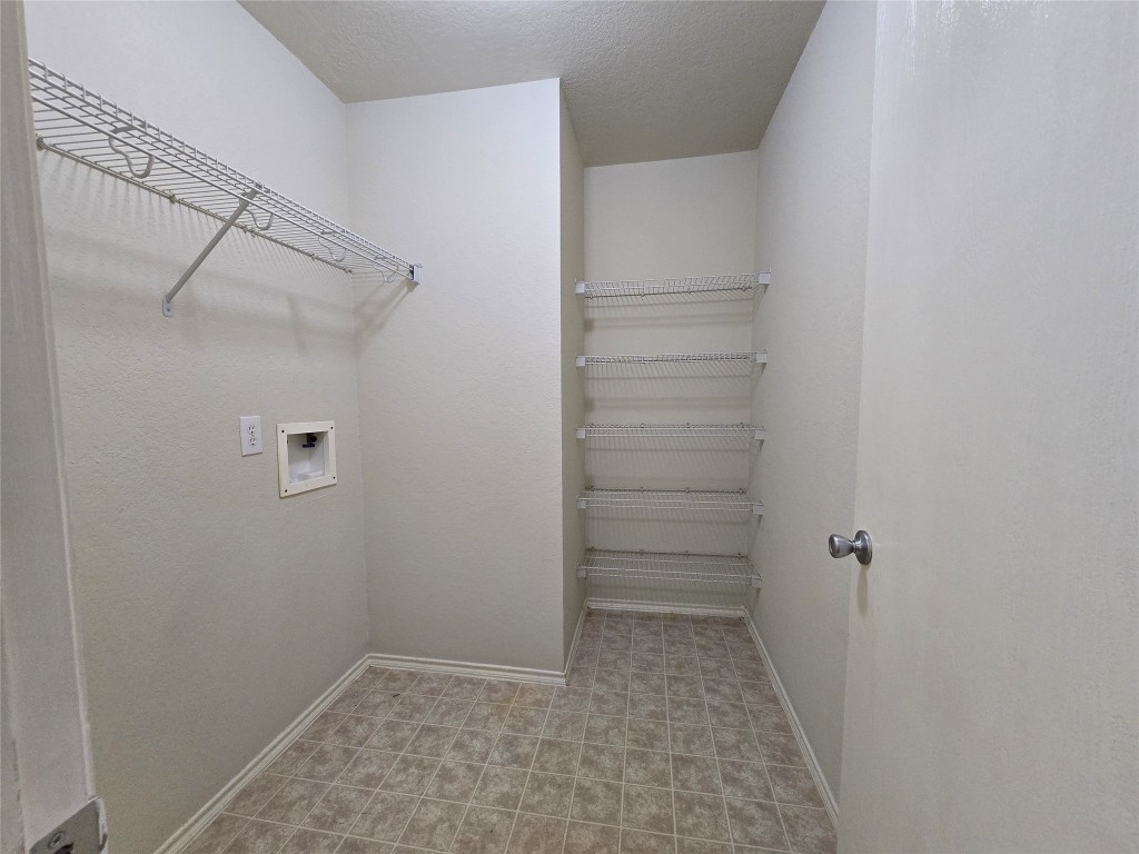 6527 Fairbrook Park Lane Spring, TX 77379 - Photo 4 of 17 a view of walk in closet with empty racks